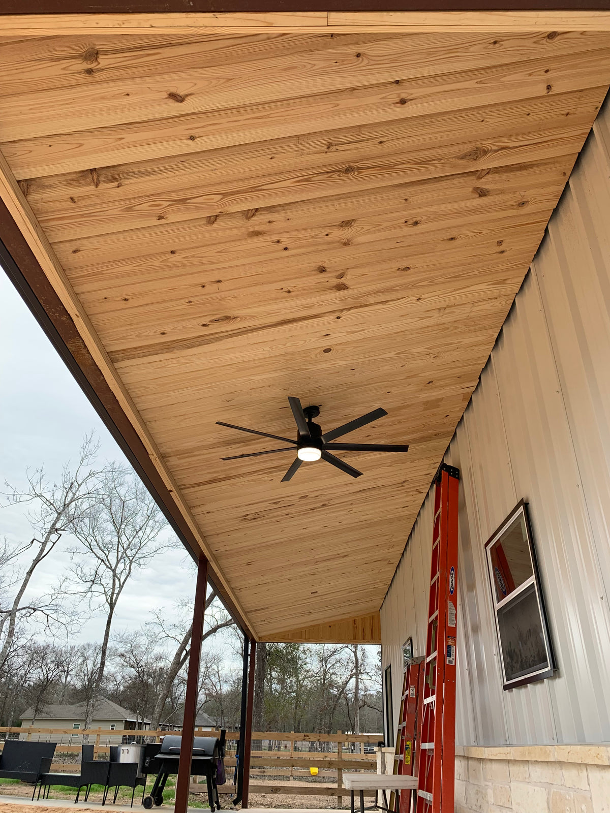 Tongue and groove longleaf pine ceiling on covered outdoor porch